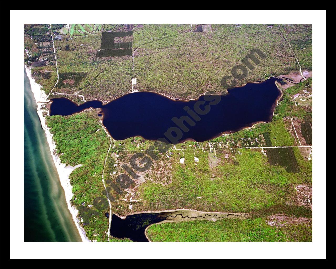 Aerial image of [1055] Duck Lake in Muskegon, MI with Black Metal frame