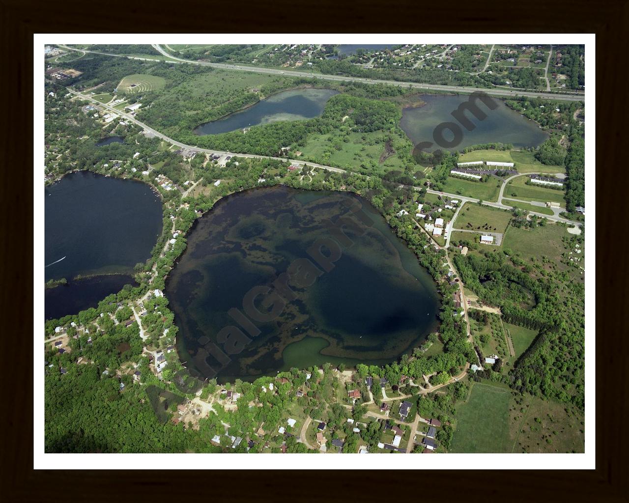 Aerial image of [107] Briggs Lake in Livingston, MI with Black Wood frame