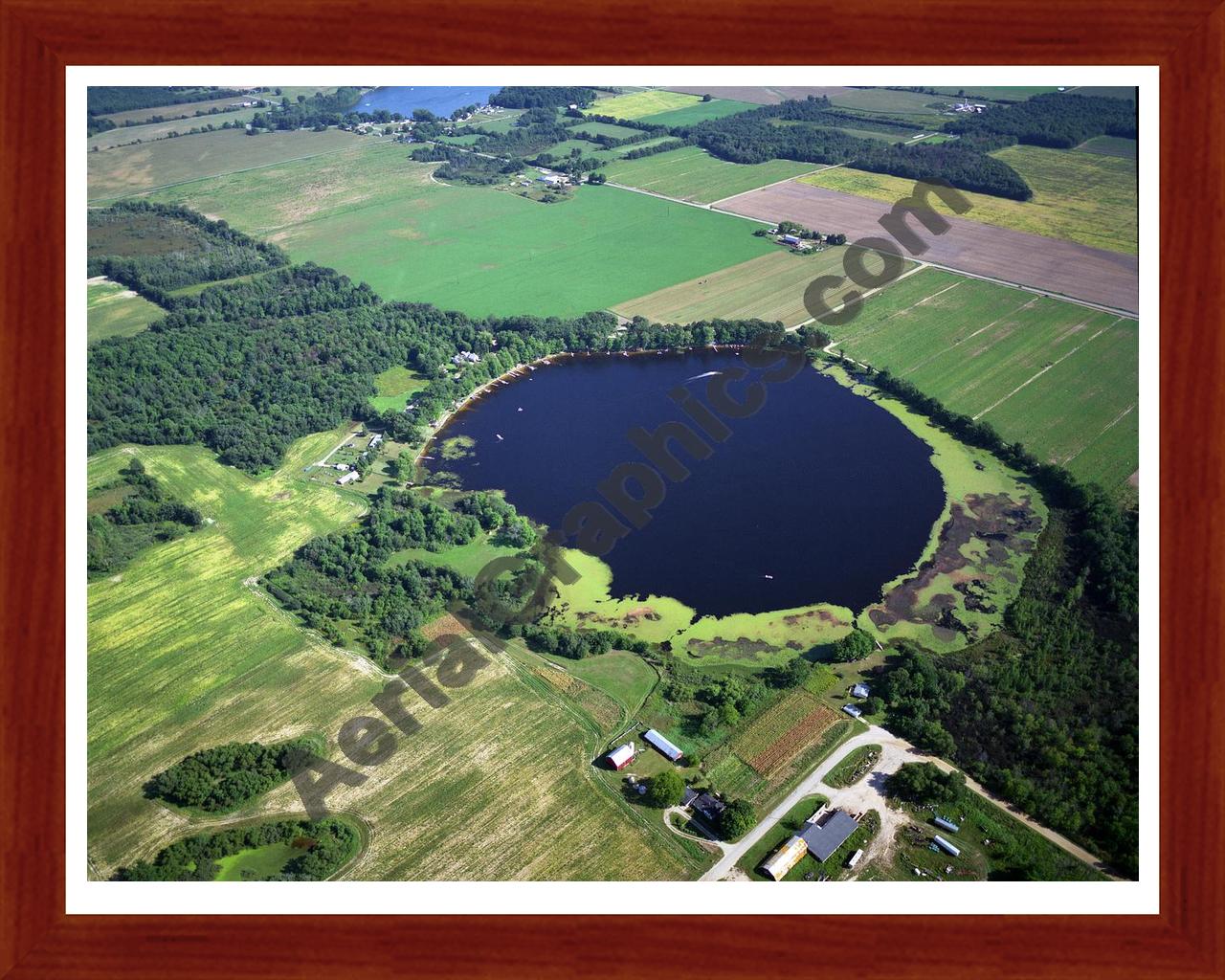 Aerial image of [1127] Coady Lake in Montcalm, MI with Cherry Wood frame