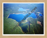 Aerial image of [1134] Nichols Lake in Newaygo, MI with Natural Wood frame