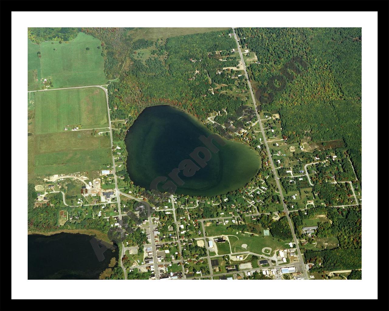 Aerial image of [113] Brownlee Lake in Alcona, MI with Black Metal frame