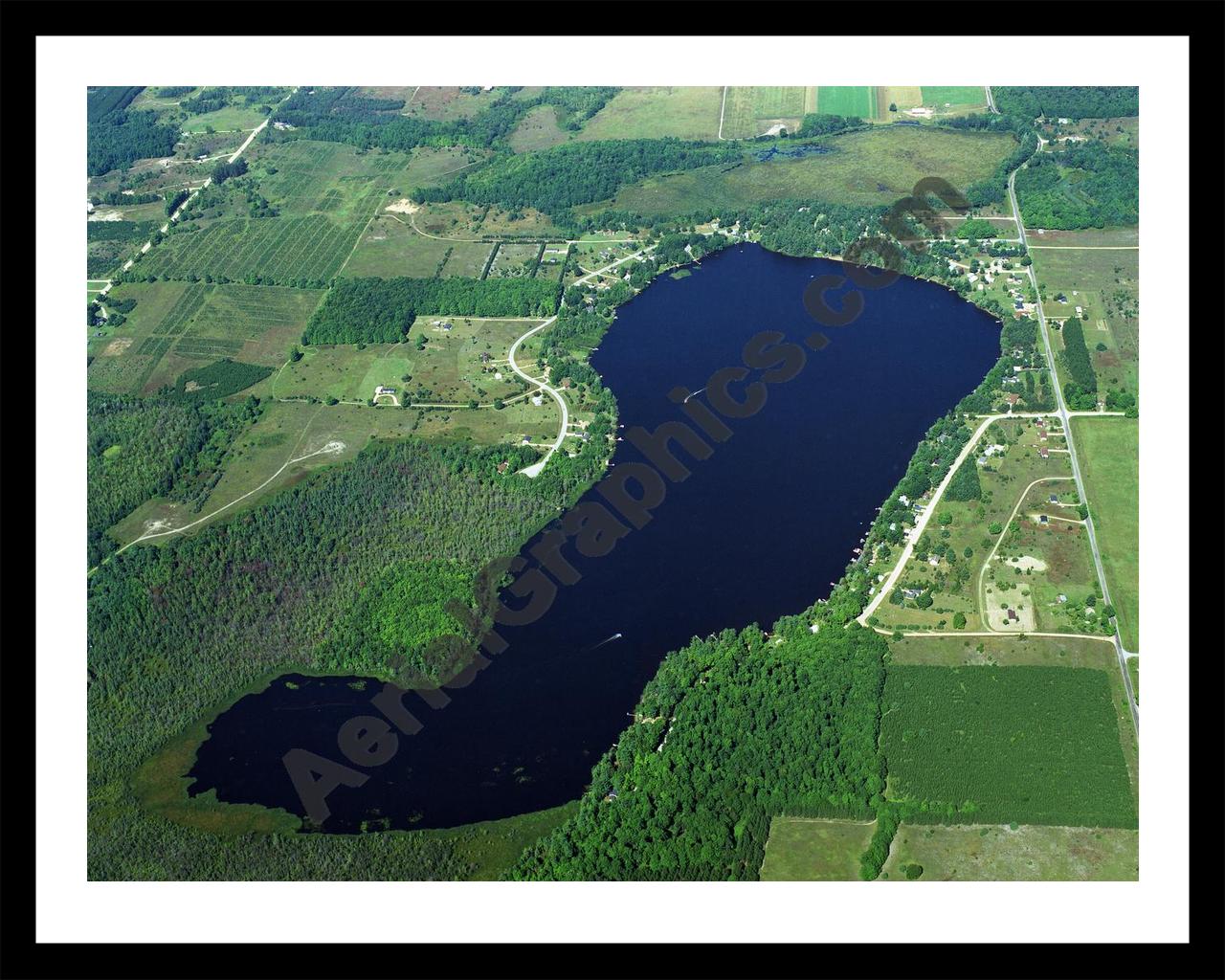 Aerial image of [1140] Crawford Lake in Kalkaska, MI with Black Metal frame