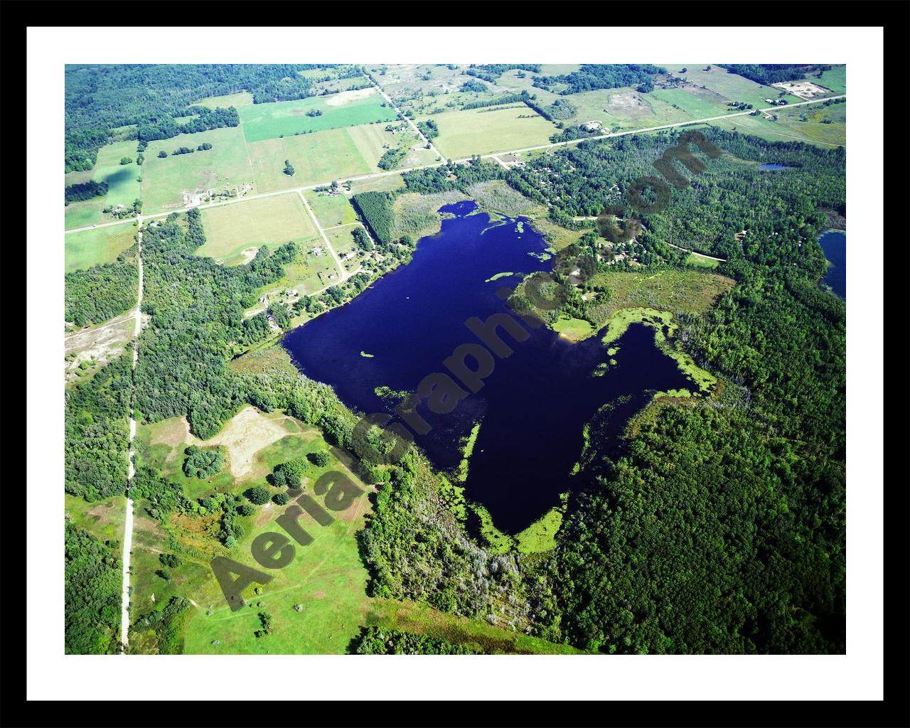 Aerial image of [1143] Merrill Lake in Mecosta, MI with Black Metal frame