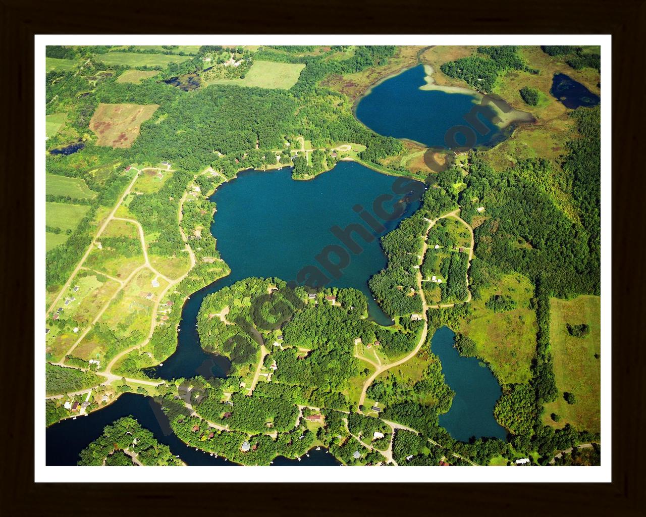 Aerial image of [1288] Mirror Lake in Jackson, MI with Black Wood frame