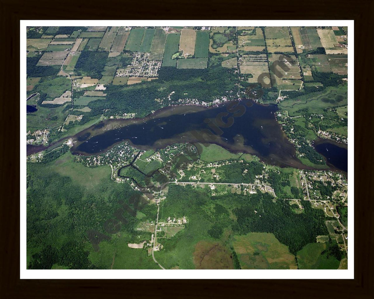 Aerial image of [1481] Wolf Lake in Jackson, MI with Black Wood frame