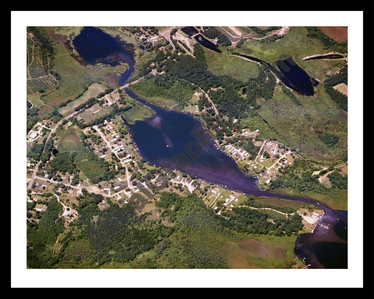 Aerial image of [1525] Olcott Lake in Jackson, MI with Black Metal frame