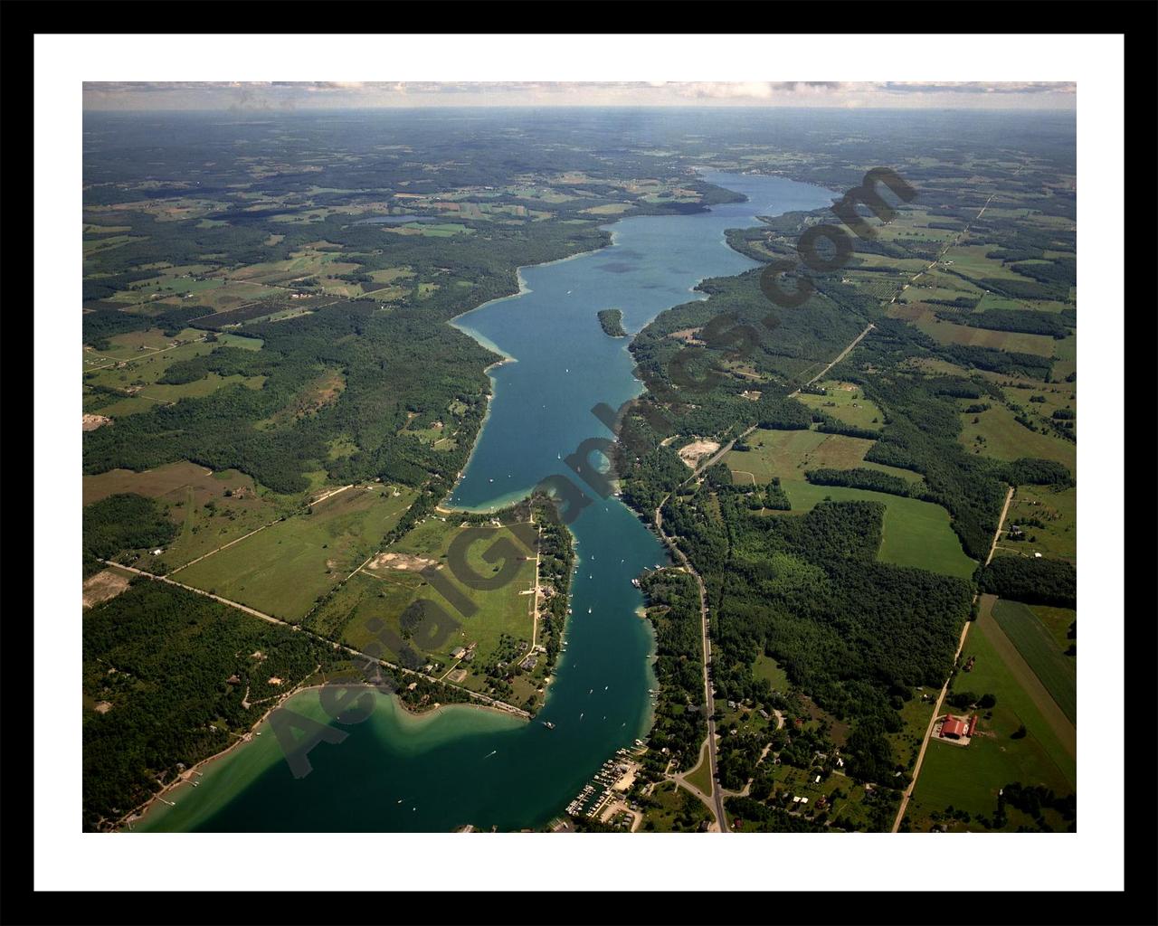 Aerial image of [1561] Lake Charlevoix (South Arm) in Charlevoix, MI with Black Metal frame