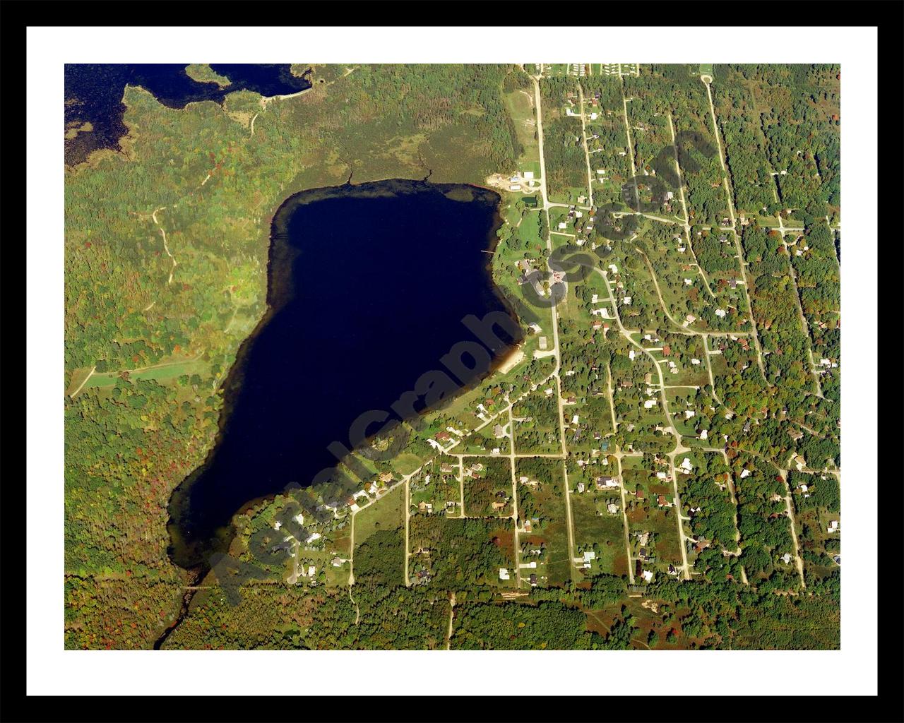 Aerial image of [21] Badger Lake in Alcona, MI with Black Metal frame