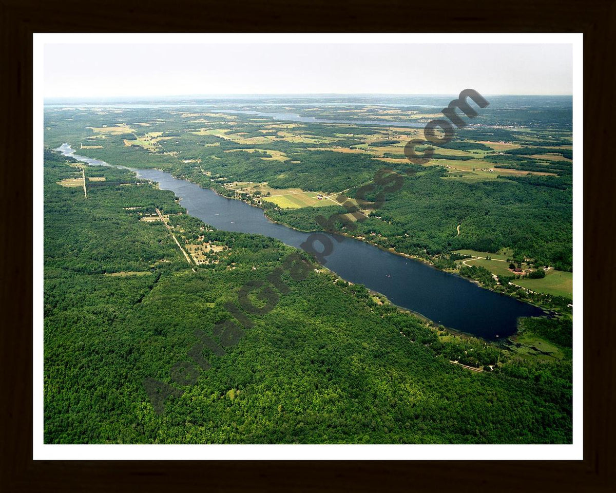 Aerial image of [2561] Sixmile Lake in Charlevoix, MI with Black Wood frame
