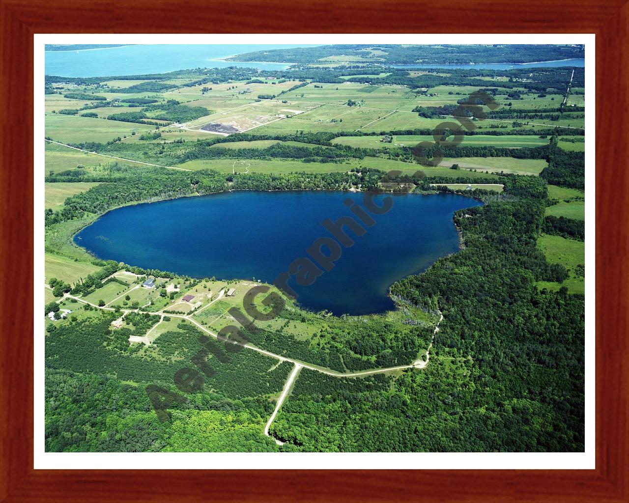 Aerial image of [2563] Nowland Lake in Charlevoix, MI with Cherry Wood frame