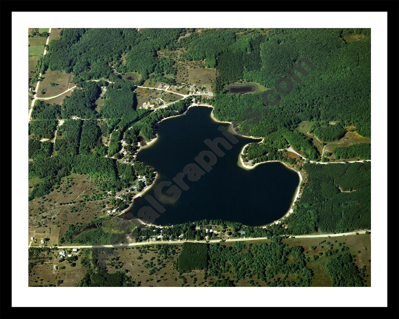 Aerial image of [2723] Meauwataka Lake in Wexford, MI with Black Metal frame