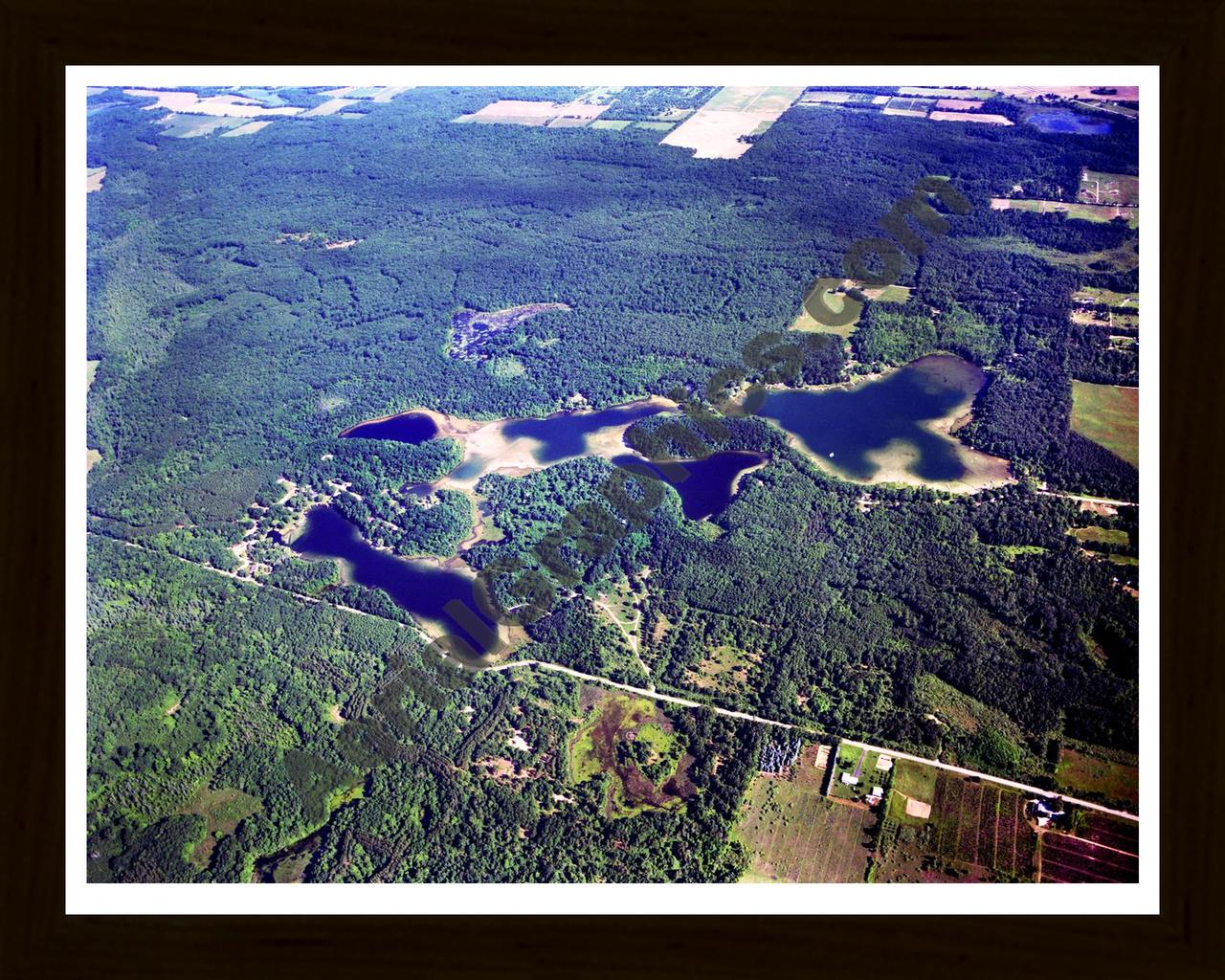 Aerial image of [2915] Spring, West, and Tacoma Lakes in Montcalm, MI with Black Wood frame