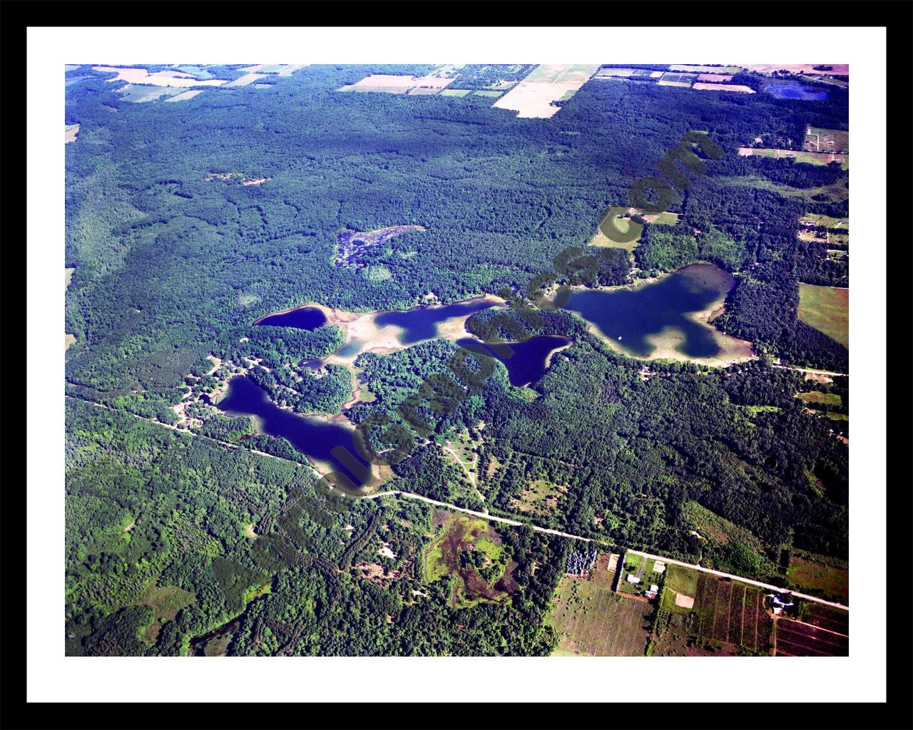 Aerial image of [2915] Spring, West, and Tacoma Lakes in Montcalm, MI with Black Metal frame