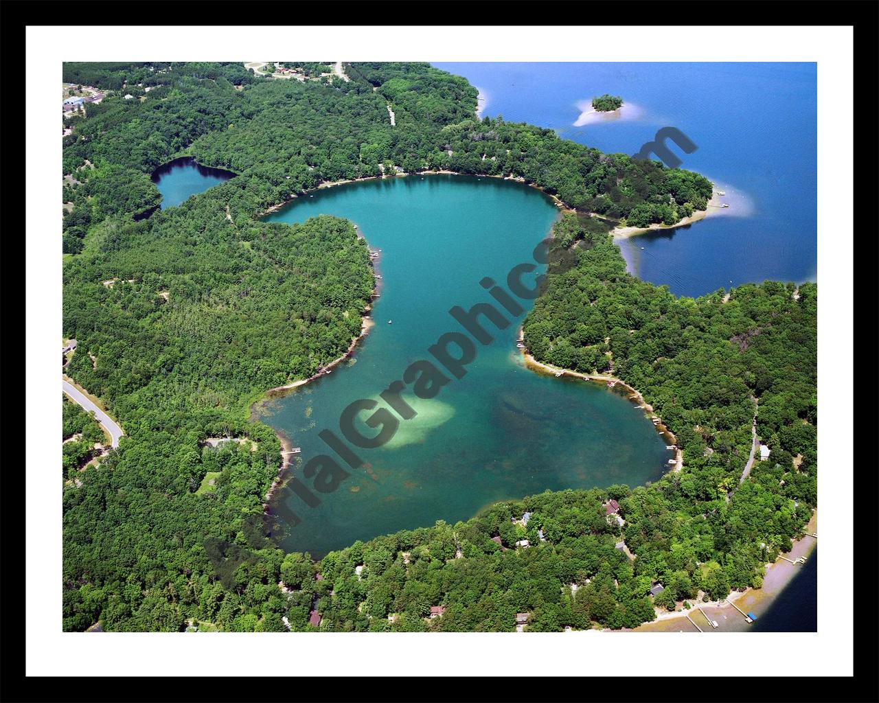 Aerial image of [2947] Mickey Lake in Grand Traverse, MI with Black Metal frame