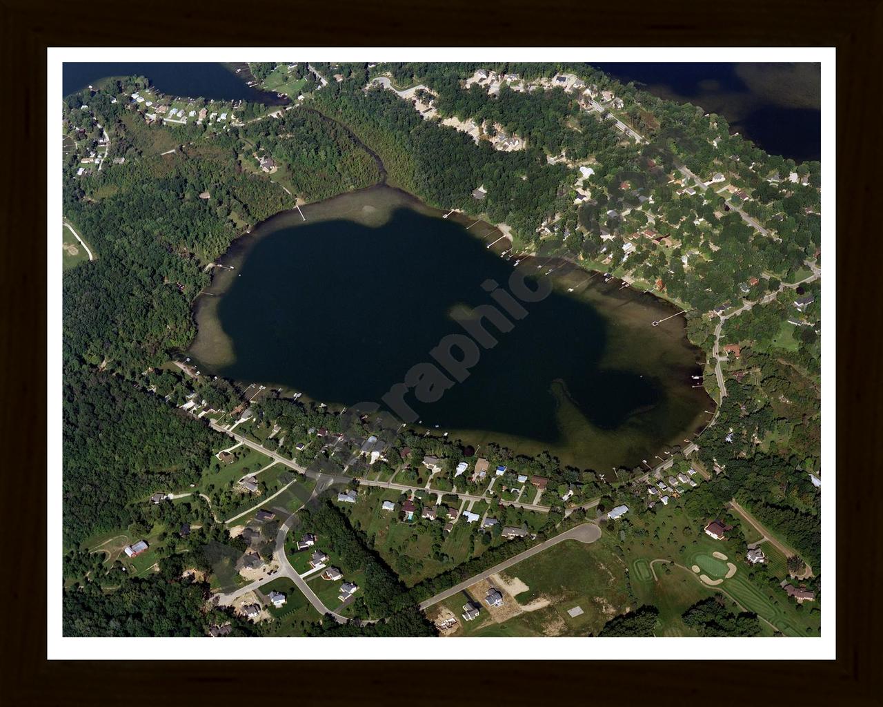 Aerial image of [2989] Maxfield Lake in Livingston, MI with Black Wood frame