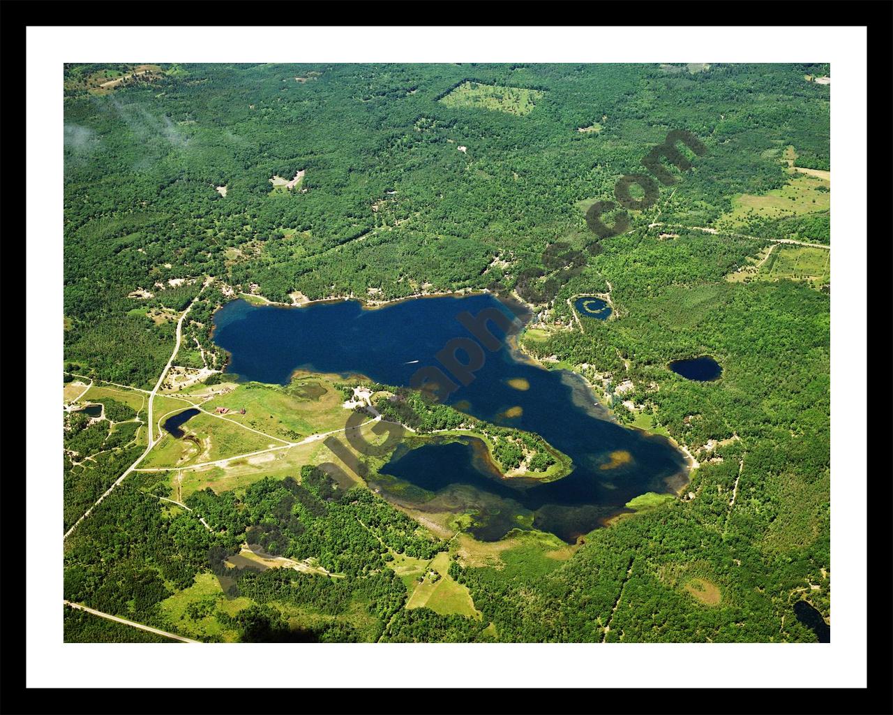 Aerial image of [3219] McCollum Lake in Oscoda, MI with Black Metal frame