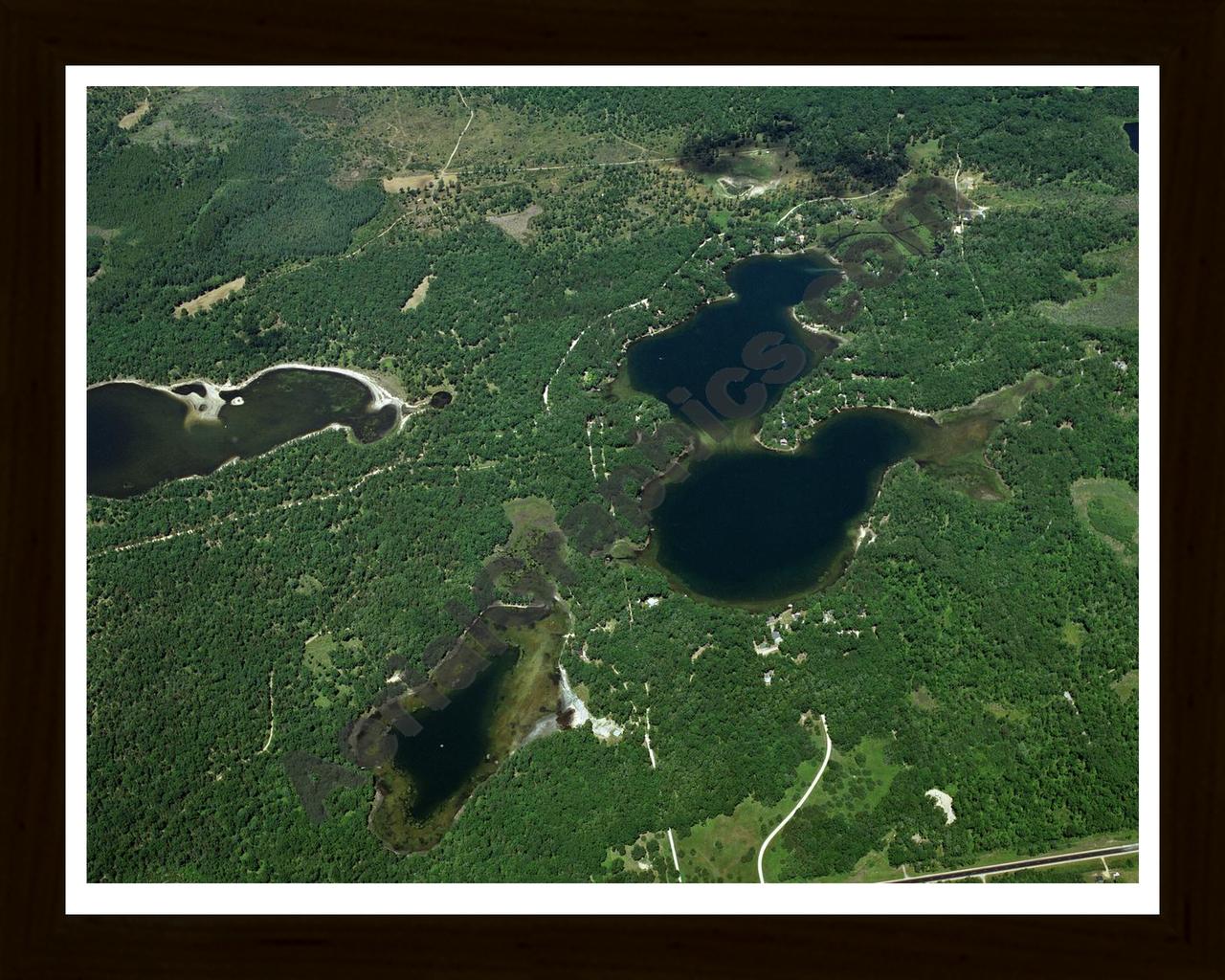 Aerial image of [3220] Crooked Lake & Meyer Lake in Alcona, MI with Black Wood frame