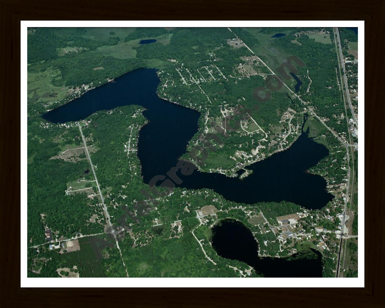 Aerial image of [3245] Crooked  Lake in Clare, MI with Black Wood frame