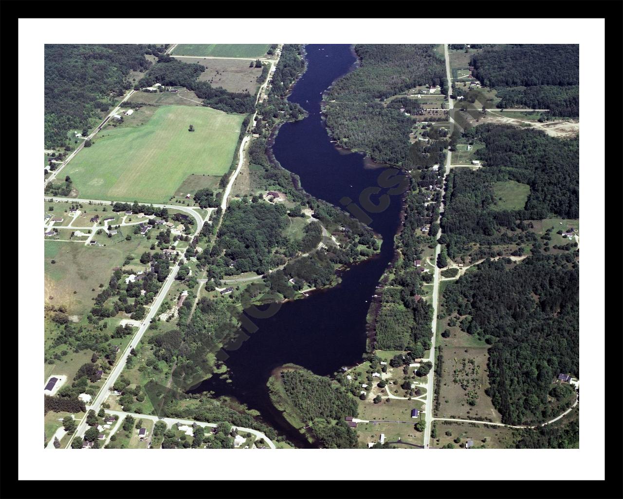 Aerial image of [331] Hanley Lake in Antrim, MI with Black Metal frame