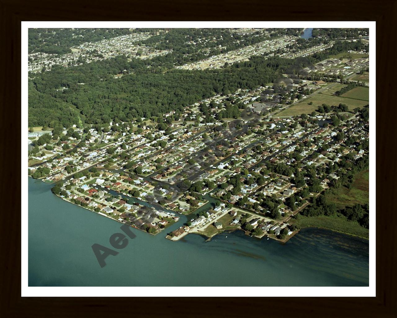 Aerial image of [3652] Pointe Rosa Subdivision with Black Wood frame