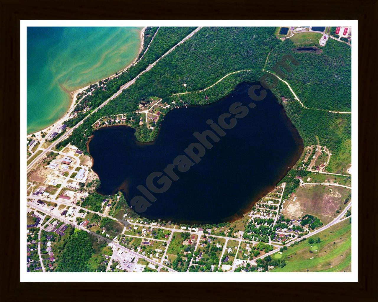 Aerial image of [36] Bass Lake in Antrim, MI with Black Wood frame