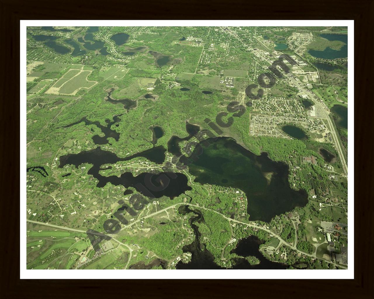 Aerial image of [379] Indianwood & Manitou Lakes in Oakland, MI with Black Wood frame