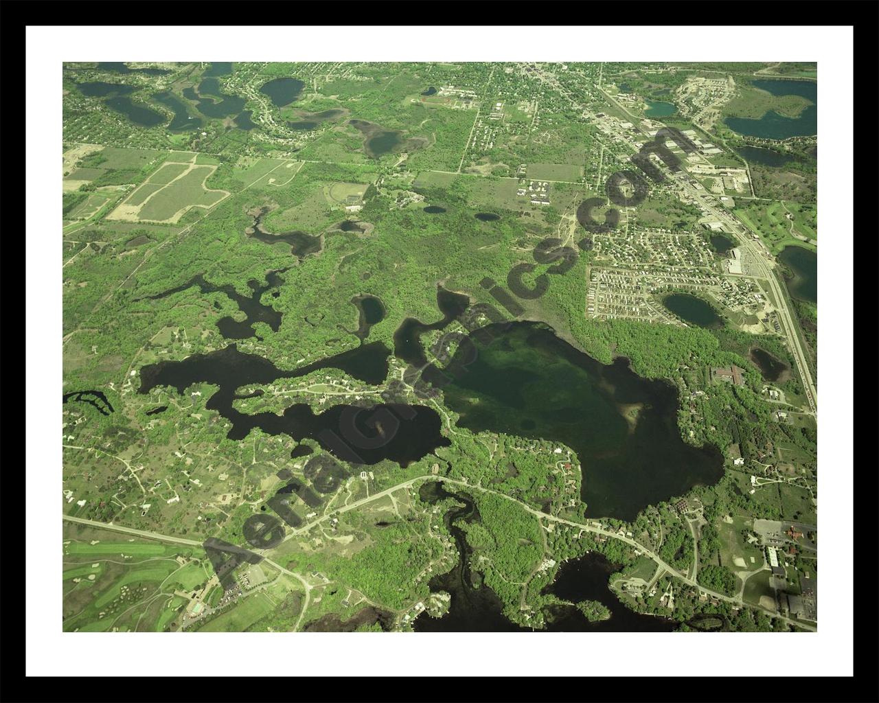 Aerial image of [379] Indianwood & Manitou Lakes in Oakland, MI with Black Metal frame