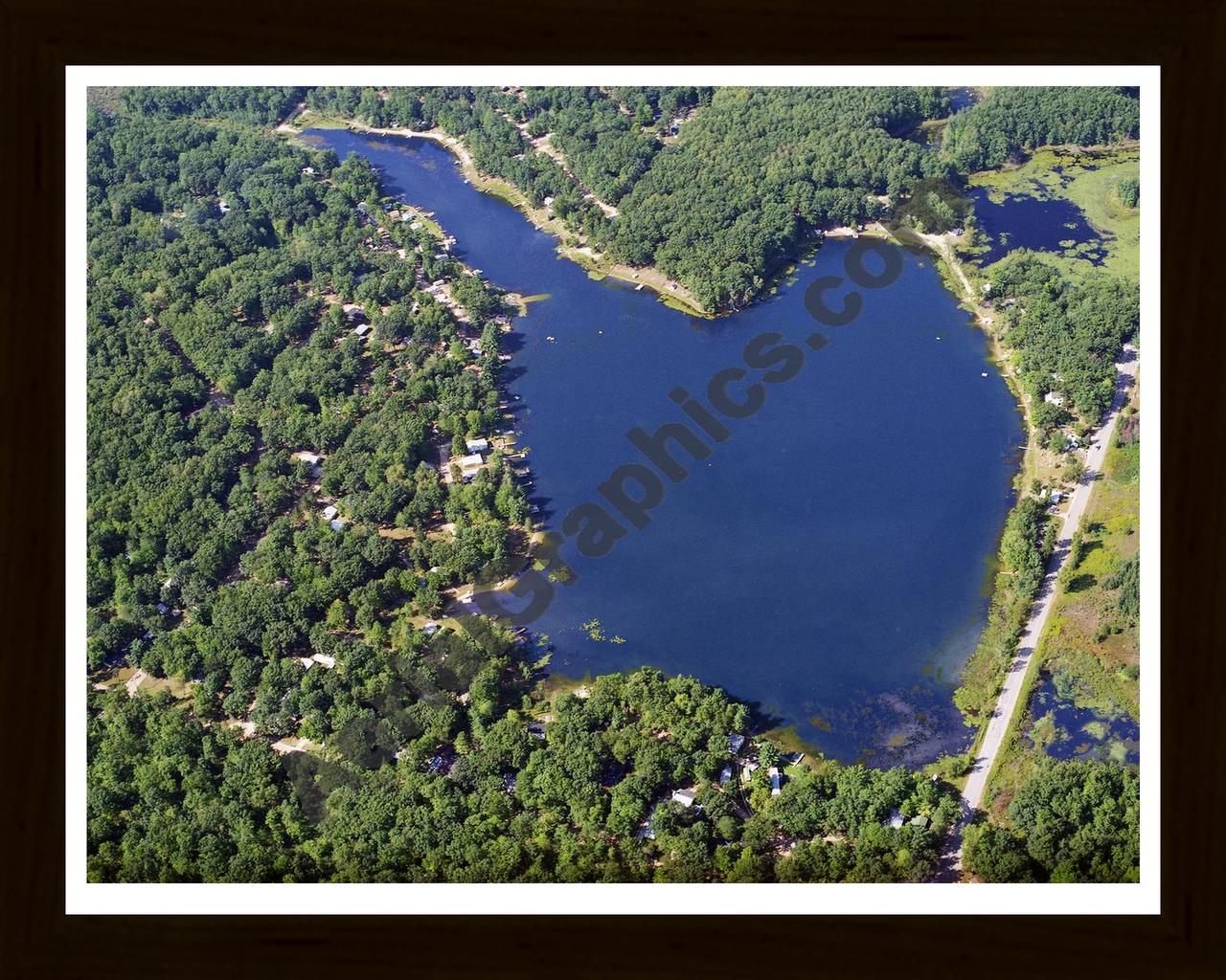 Aerial image of [3832] Bertha Lake in Clare, MI with Black Wood frame