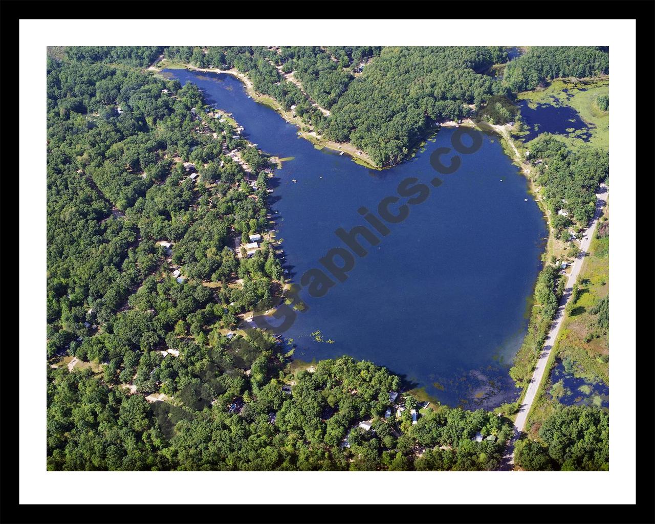 Aerial image of [3832] Bertha Lake in Clare, MI with Black Metal frame