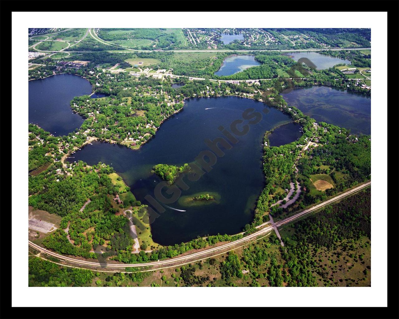 Aerial image of [384] Island Lake in Livingston, MI with Black Metal frame