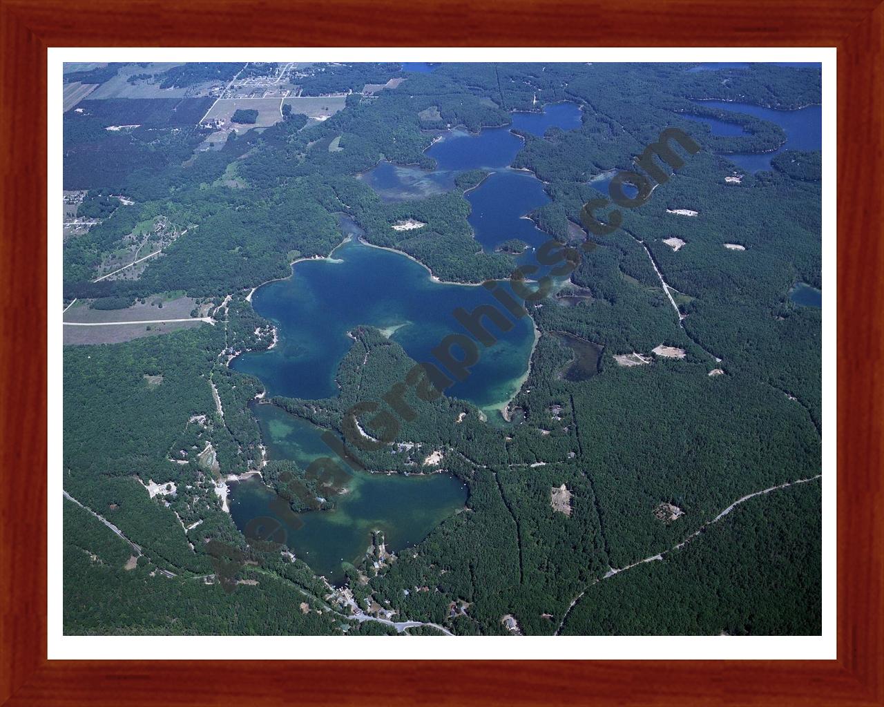 Aerial image of [3920] Arbutus Lake in Grand Traverse, MI with Cherry Wood frame