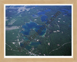 Aerial image of [3920] Arbutus Lake in Grand Traverse, MI with Natural Wood frame