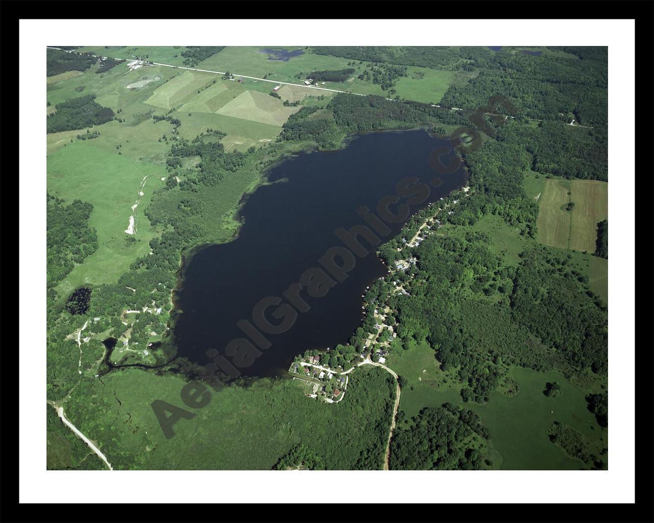 Aerial image of [3928] Hicks Lake in Osceola, MI with Black Metal frame