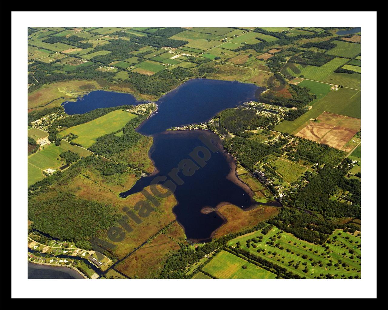 Aerial image of [394] Juno Lake in Cass, MI with Black Metal frame