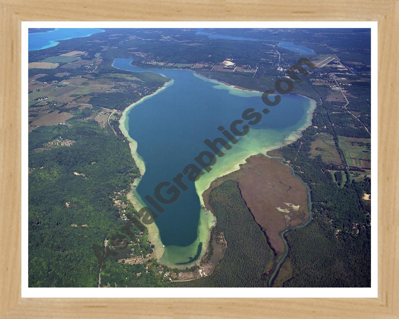 Aerial image of [4008] Lake Bellaire in Antrim, MI with Natural Wood frame