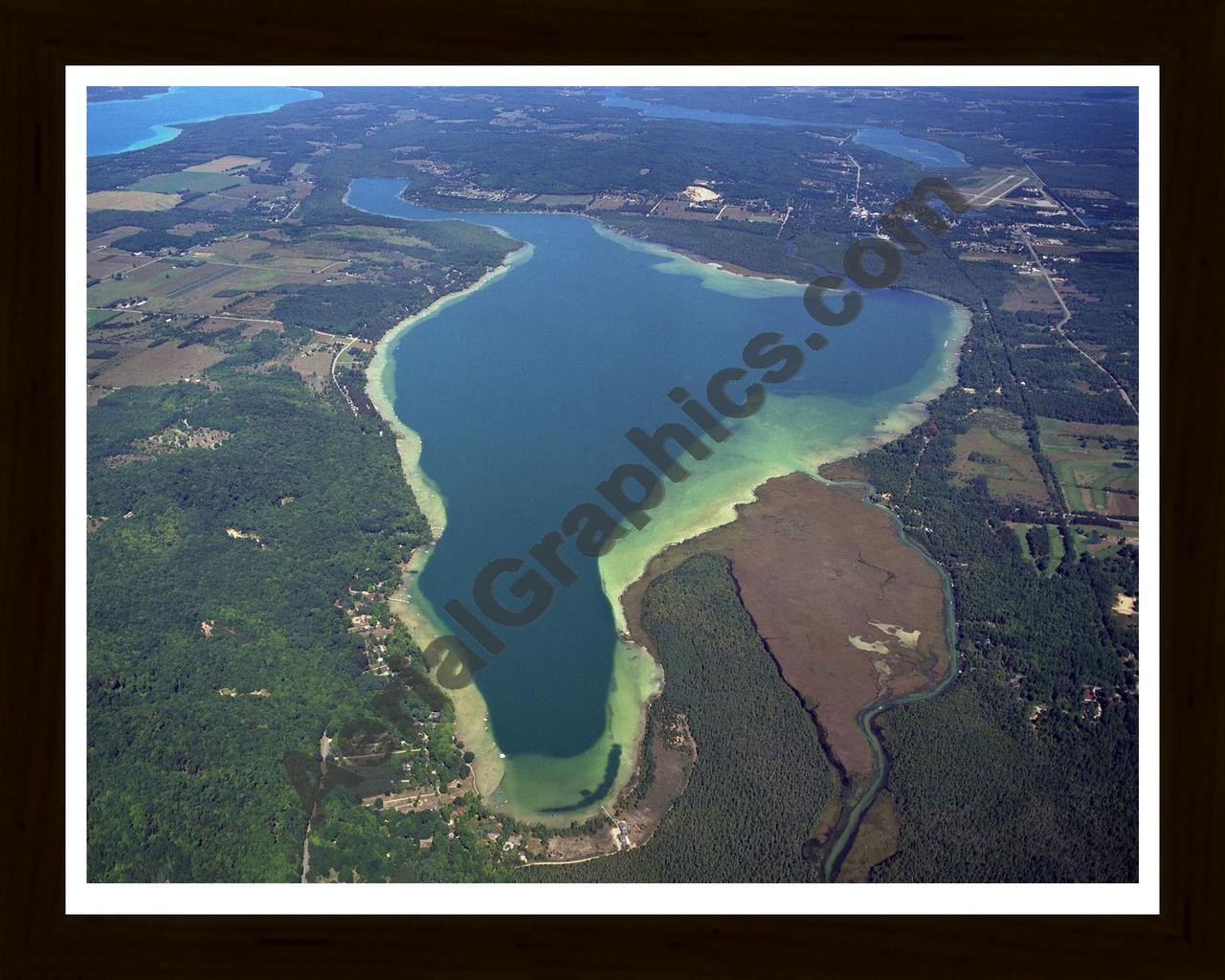 Aerial image of [4008] Lake Bellaire in Antrim, MI with Black Wood frame