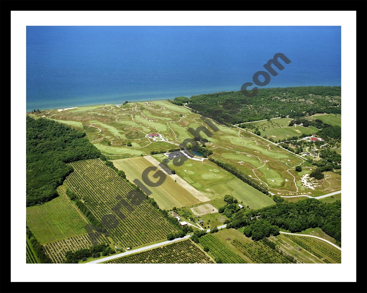 Aerial image of [4248] Arcadia Bluffs Golf Club looking West with Black Metal frame