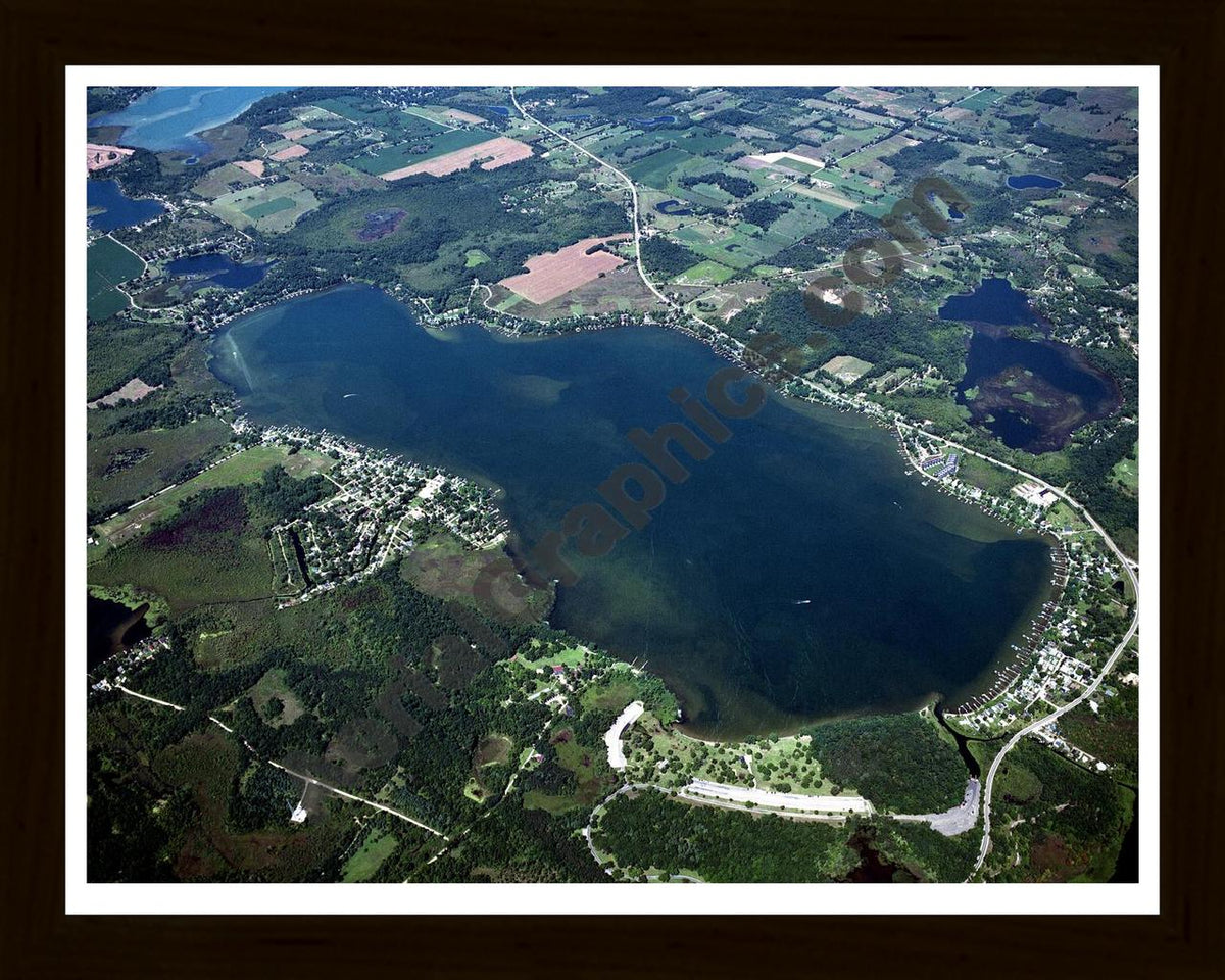 Aerial image of [4261] Wamplers Lake in Jackson, MI with Black Wood frame