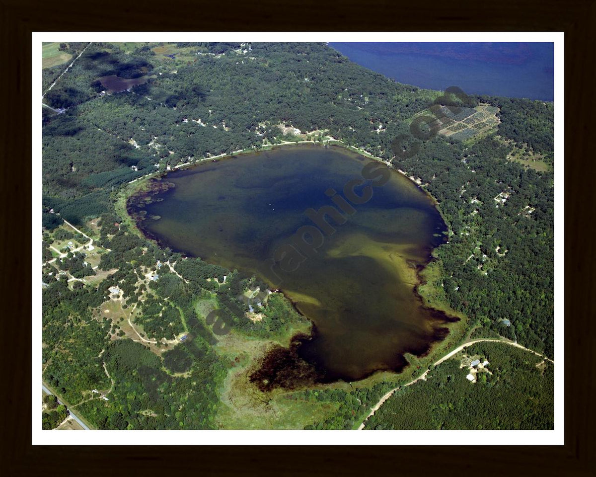 Aerial image of [4284] Tallman Lake in Mason, MI with Black Wood frame