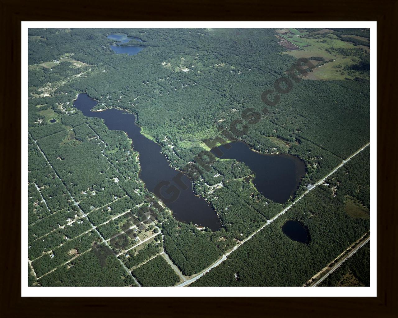 Aerial image of [4287] Long Lake & Emerson Lake in Mason, MI with Black Wood frame