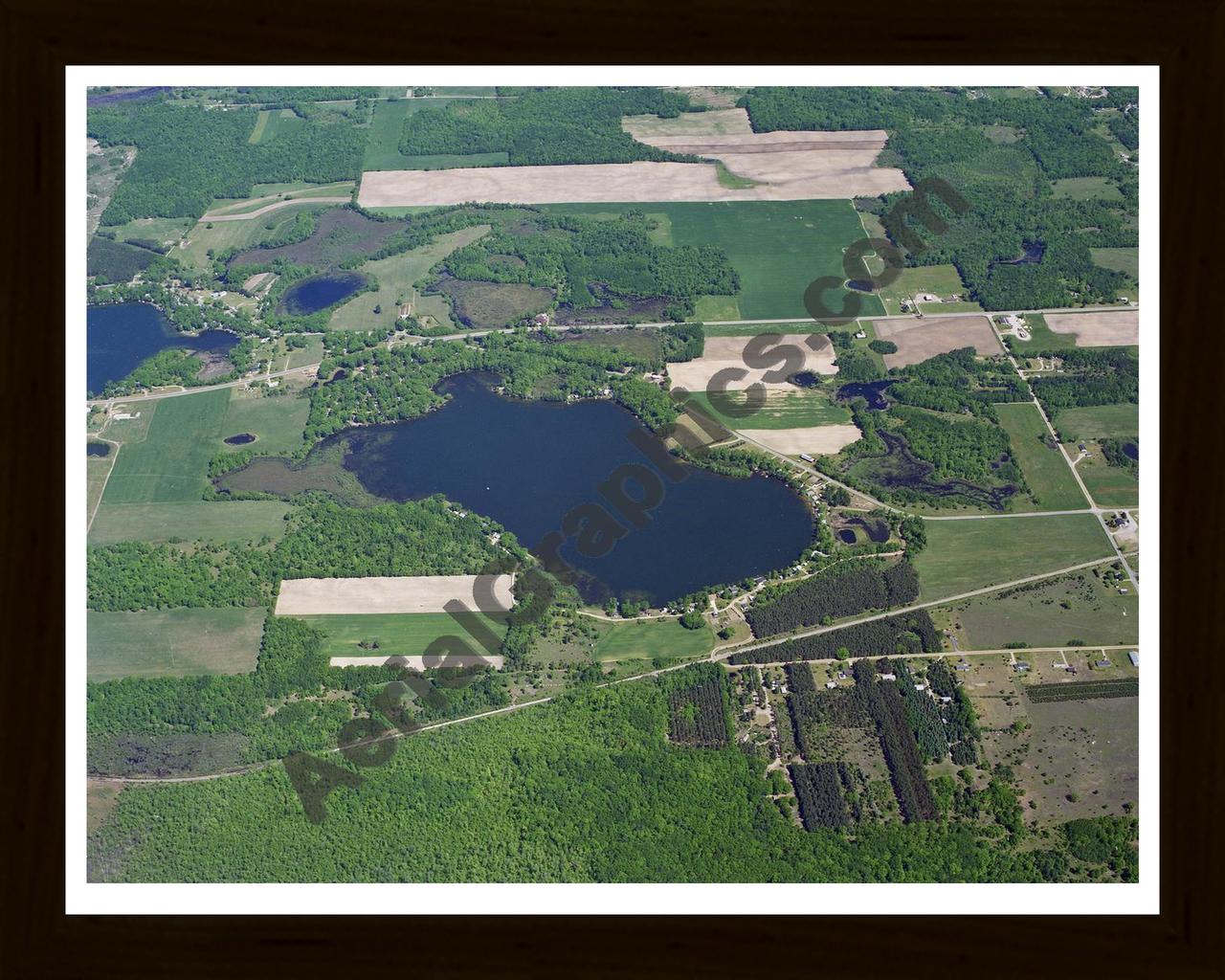 Aerial image of [42] Bass Lake (Richland Twp) in Montcalm, MI with Black Wood frame