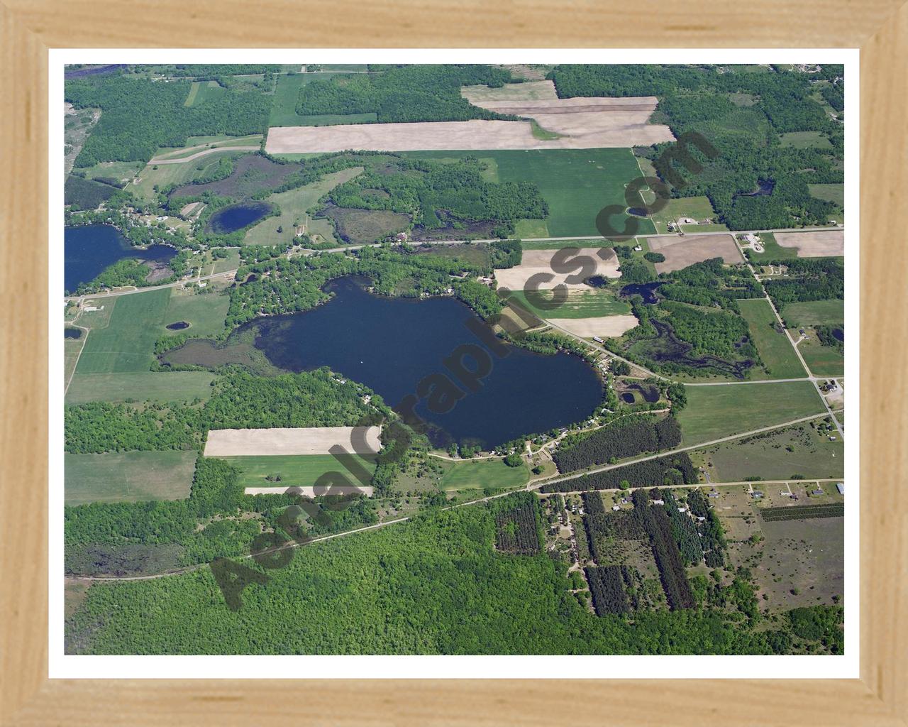 Aerial image of [42] Bass Lake (Richland Twp) in Montcalm, MI with Natural Wood frame