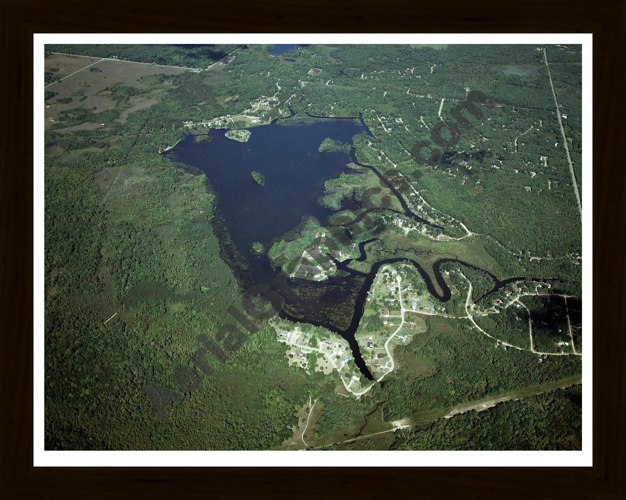 Aerial image of [4324] Doc and Tom Lake in Clare, MI with Black Wood frame