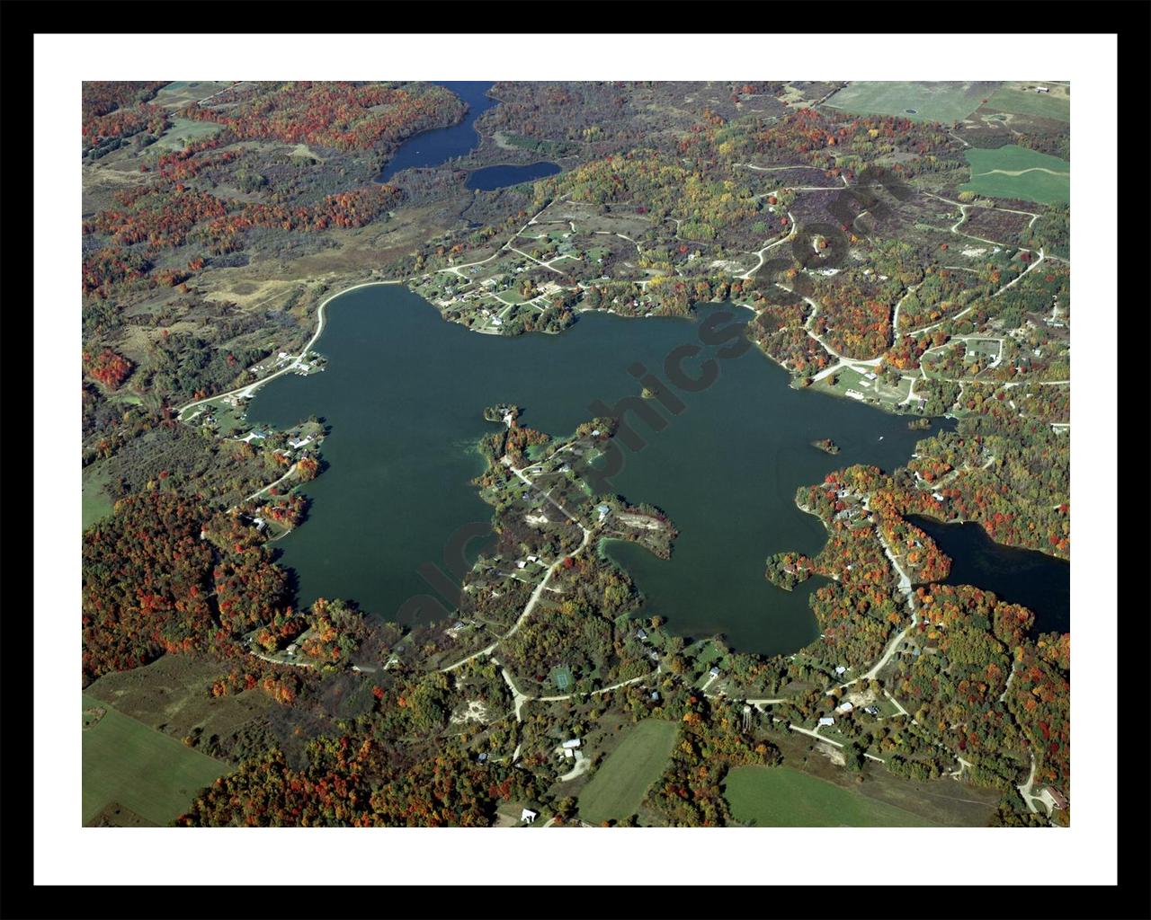 Aerial image of [4360] Miramichi Lake in Osceola, MI with Black Metal frame