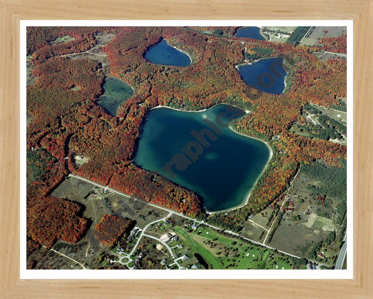 Aerial image of [4468] Lake Twentyseven in Otsego, MI with Natural Wood frame