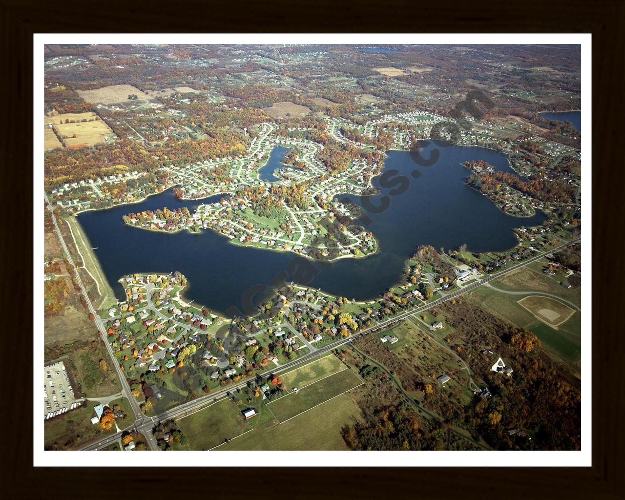 Aerial image of [4561] Lake Bella Vista (Fall) in Kent, MI with Black Wood frame