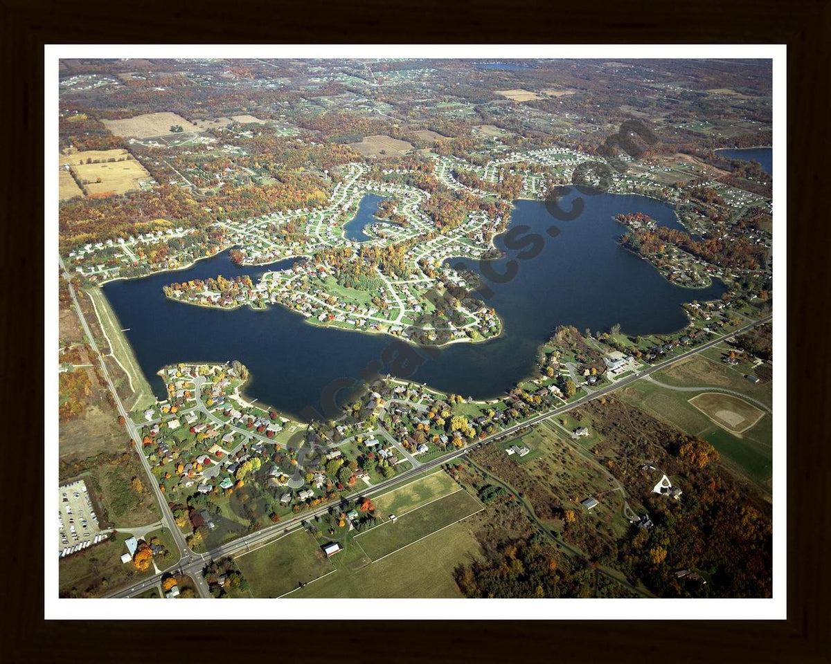 Aerial image of [4561] Lake Bella Vista (Fall) in Kent, MI with Black Wood frame