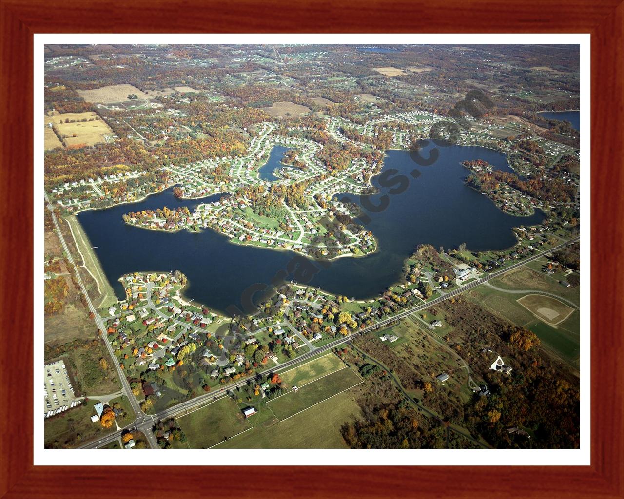 Aerial image of [4561] Lake Bella Vista (Fall) in Kent, MI with Cherry Wood frame