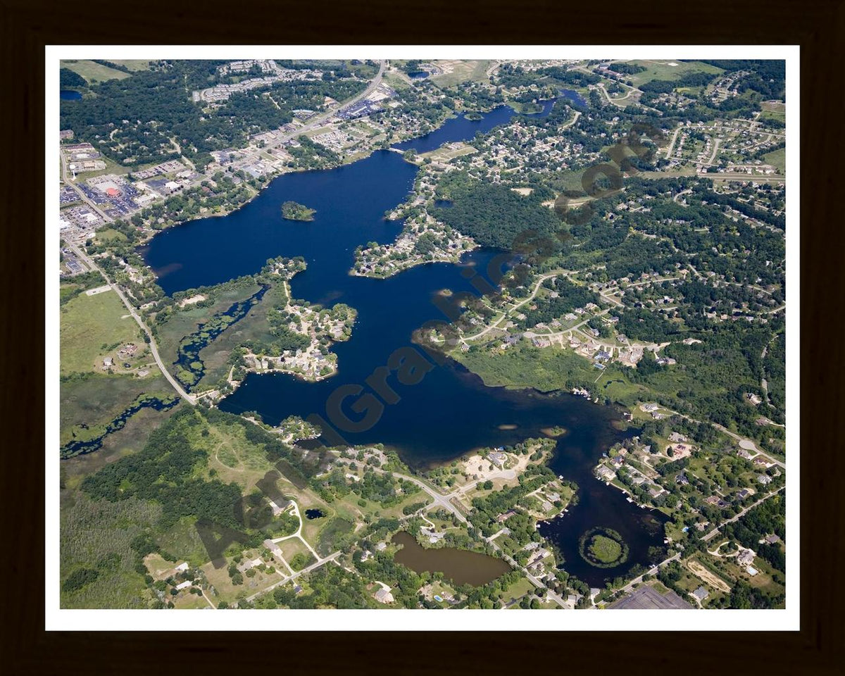Aerial image of [4669] Woodland Lake in Livingston, MI with Black Wood frame