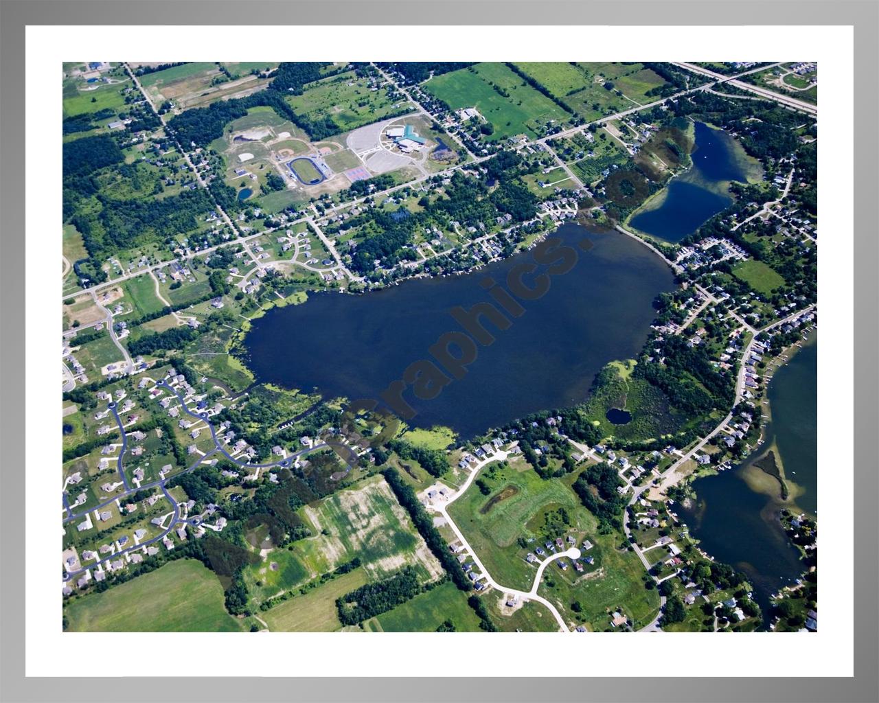 Aerial image of [4675] Loon Lake in Geness, MI with Silver Metal frame